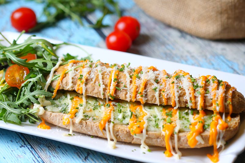 Cheesy garlic bread with herb butter and mozzarella
