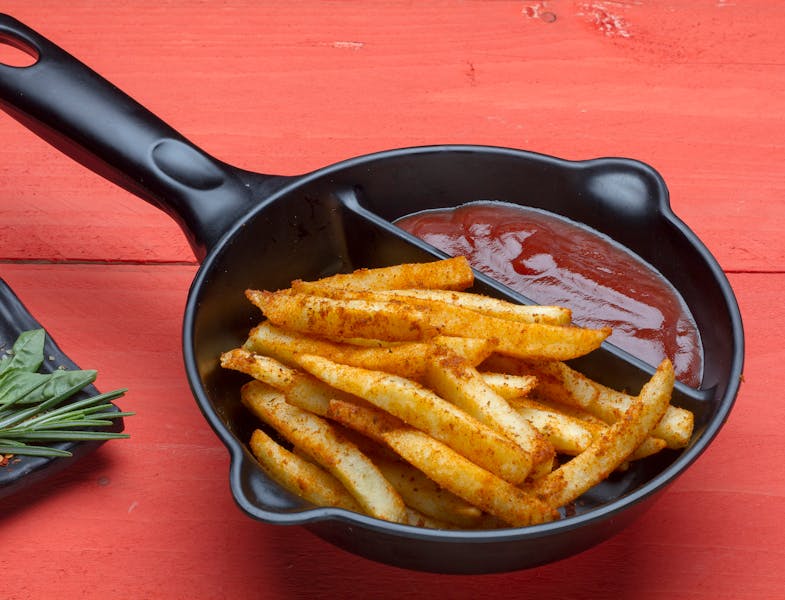 Crispy seasoned fries with house dipping sauce