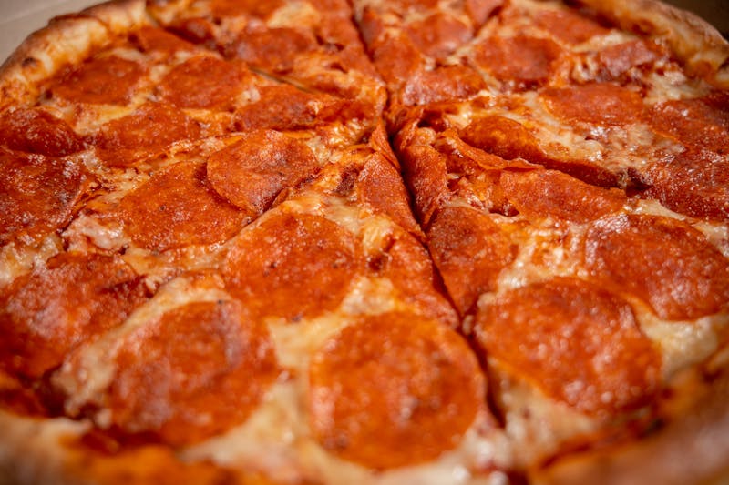 BBQ Chicken Pizza with smoky sauce and caramelized onions